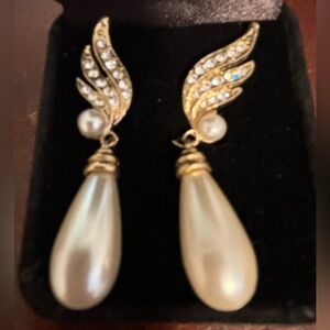 Fashion gold tone pierced earrings with large tear drop pearl and crystals.